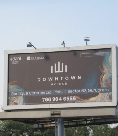 Top 10 outdoor advertising agencies in India featuring a premium billboard campaign by Providence Adworks showcasing Downtown Avenue commercial plots in Gurugram