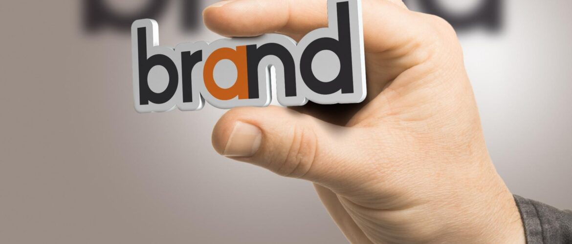 Famous branding agencies in Gurgaon concept with hand holding brand identity text