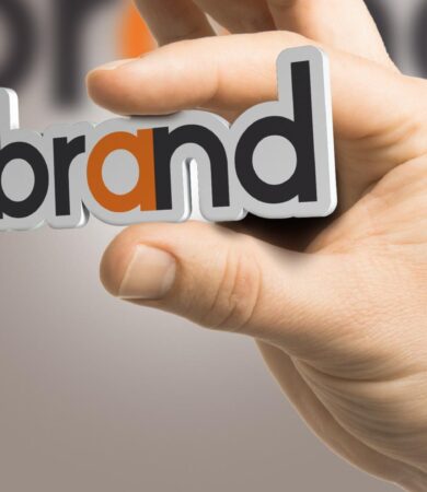 Famous branding agencies in Gurgaon concept with hand holding brand identity text